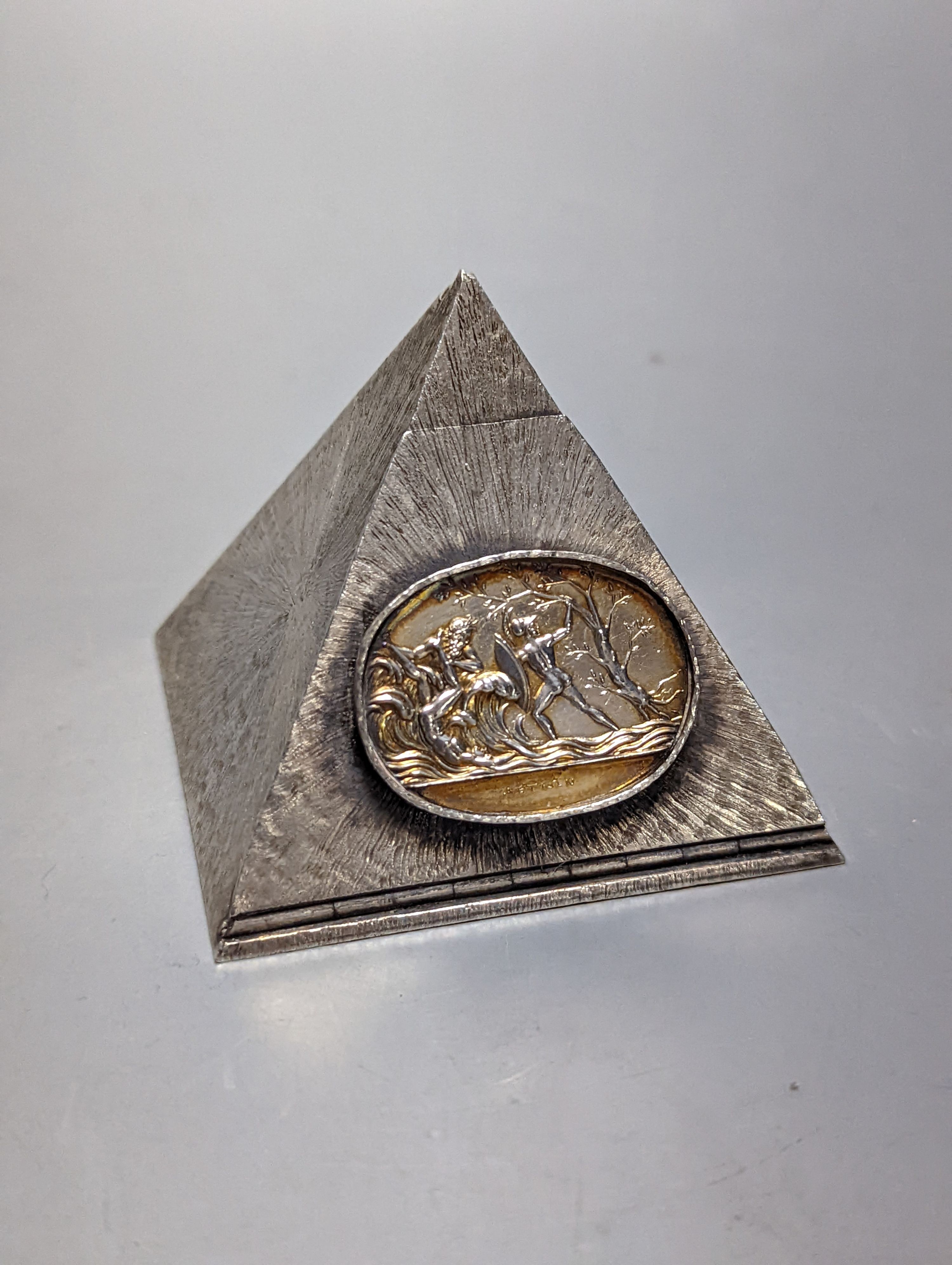 A boxed Collingwood of Conduit Street white metal pyramid shaped box, containing five dice and with applied oval plaque, height 61mm.